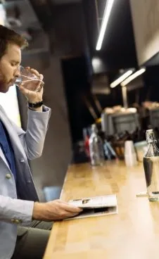 businessman-drinking-water-2021-08-29-01-52-34-utc